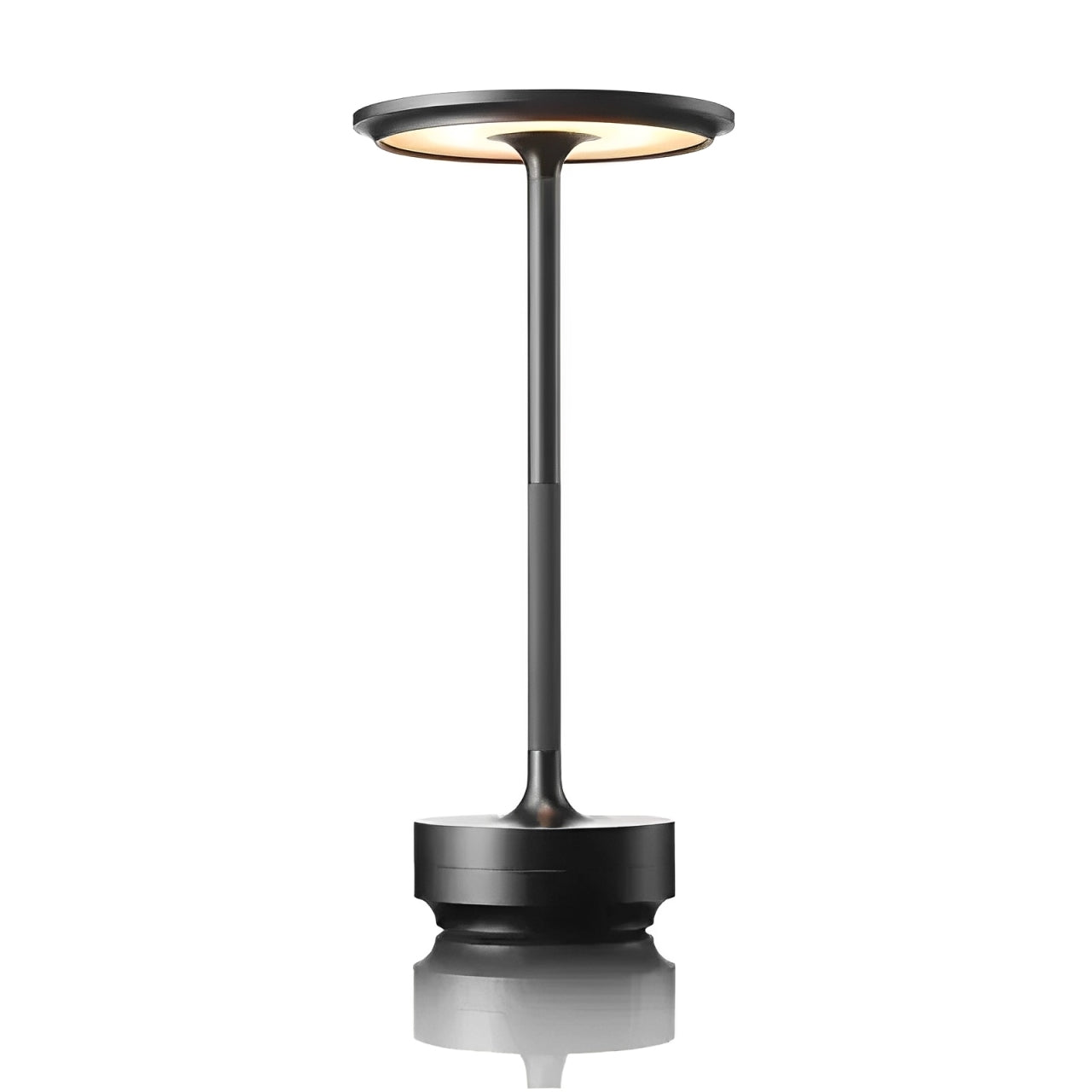 A sleek, modern black table lamp with a circular top and slender pole, reflecting softly on a surface below.