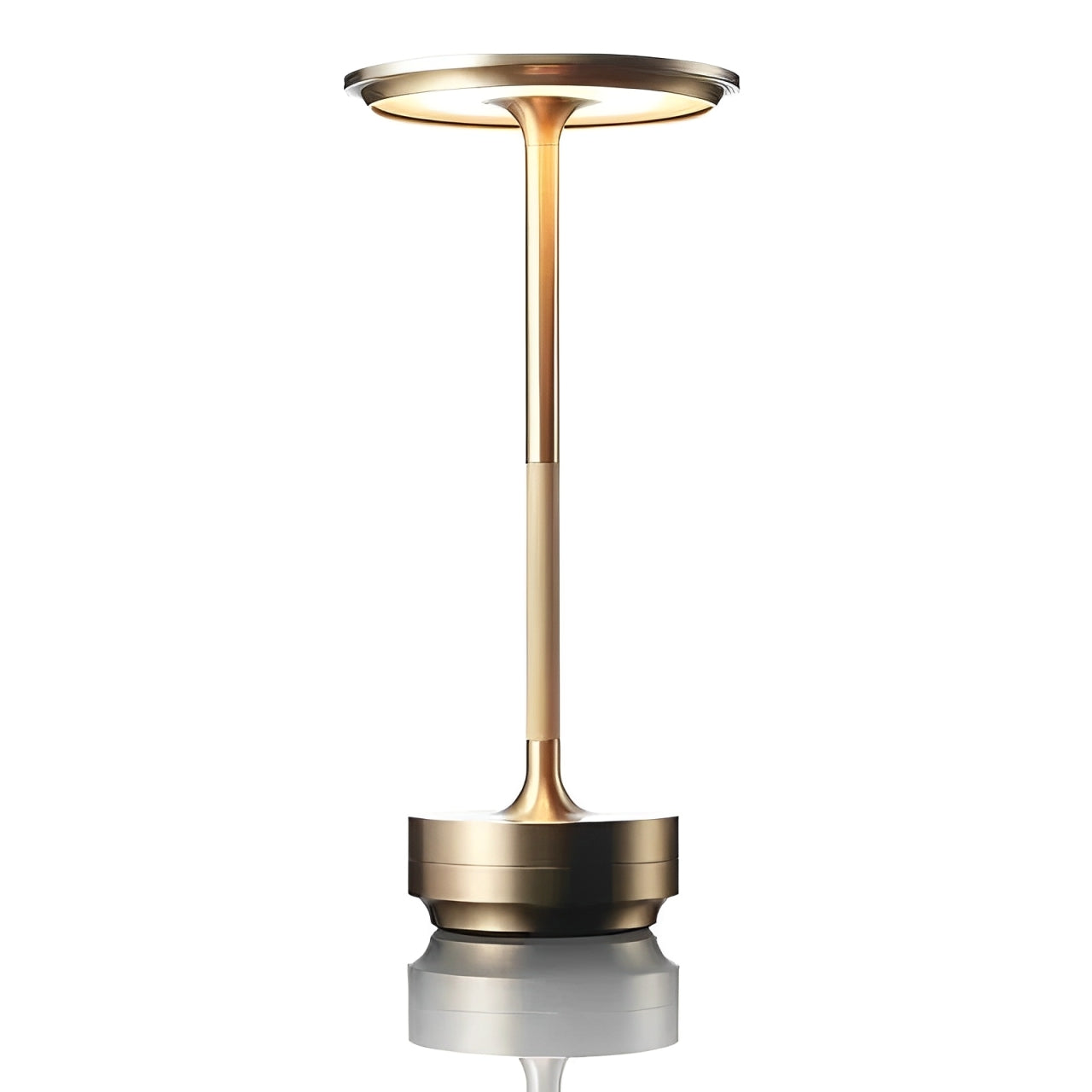 A sleek, modern gold table lamp with a circular top and slender pole, reflecting softly on a surface below.